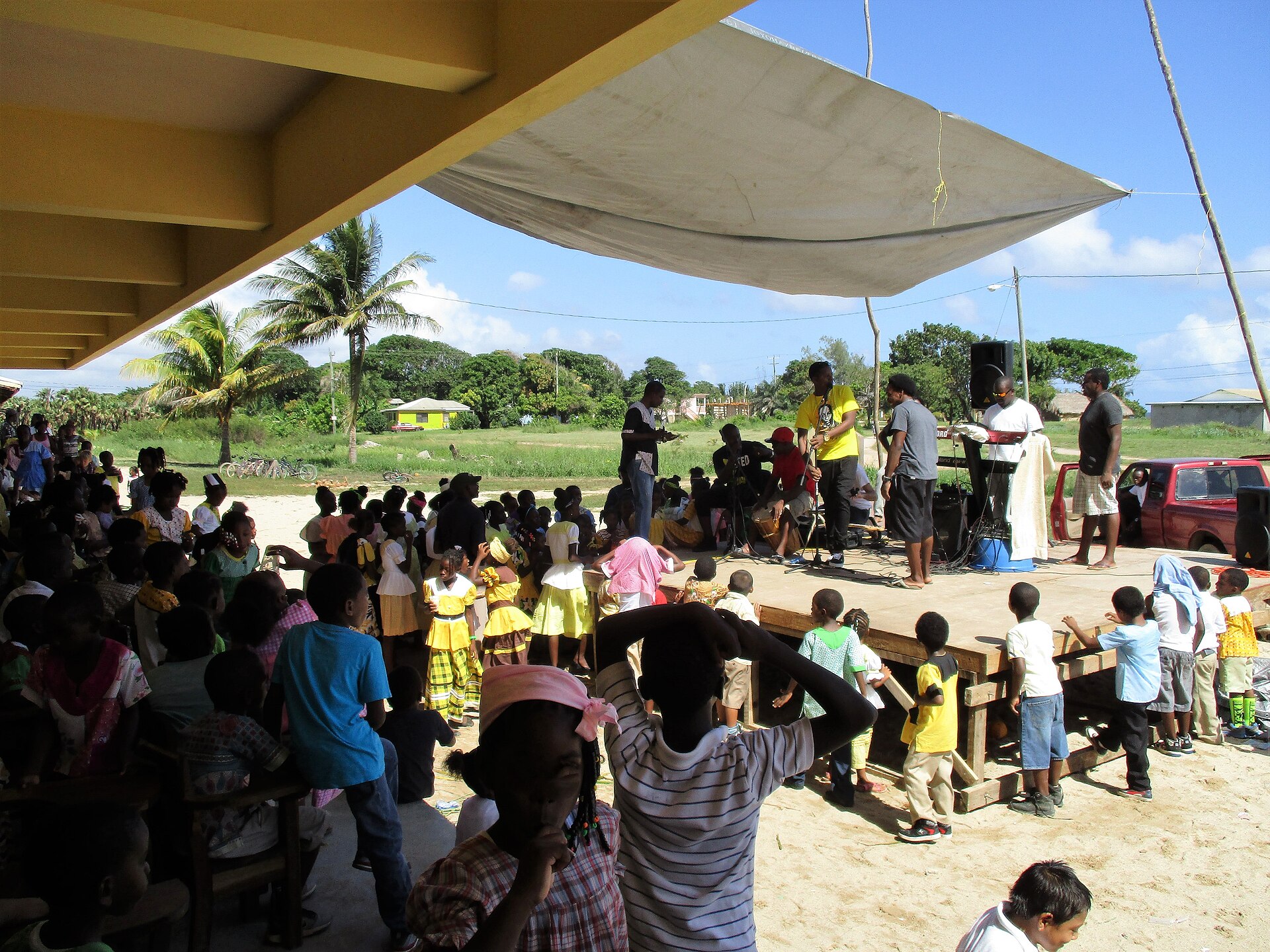 Garifuna community celebrating Garifuna Settlement Day with traditional dress in Hopkins, Belize
